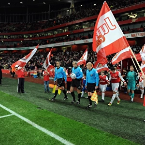 The Junior Gunners do a guard of honour as the teams walk out. Arsenal 2: 0 Wigan Athletic