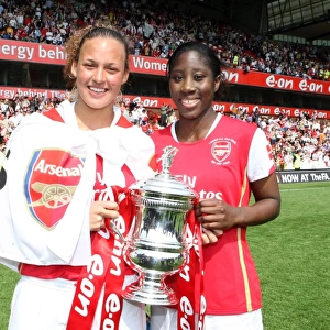 Lianne Sanderson and Anita Asante (Arsenal) with the FA Cup Trophy