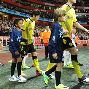 LONDON, ENGLAND - NOVEMBER 23: Player escorts before the UEFA Champions League Group F match between Arsenal FC and Borussia Dortmund at Emirates Stadium on November 23, 2011 in London, England. (Photo by David Price / Arsenal FC via