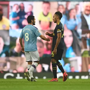 Manchester Rivalry: Aubameyang and Gundogan Embrace After Thrilling Manchester City vs. Arsenal Clash (Premier League 2019-20)
