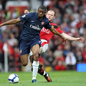 Manchester United Edge Past Arsenal: Diaby vs. Rooney in a Tight 2:1 Battle