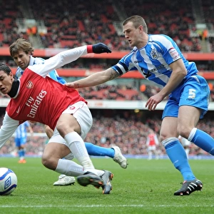 Marouane Chamakh (Arsenal) Peter Clarke (Huddersfield). Arsenal 2: 1 Huddersfield Town