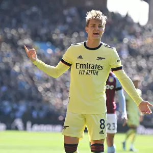 Martin Odegaard in Action: Arsenal's Midfield Maestro Shines Against Aston Villa in the Premier League 2021-22