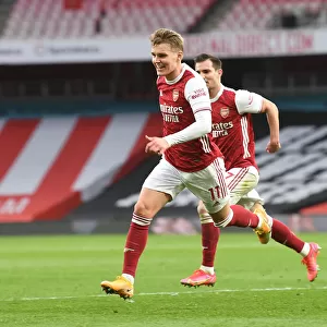 Martin Odegaard's Goal: Arsenal's Victory Over Tottenham Amidst Empty Emirates Stadium (2020-21)