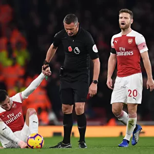 Mesut Ozil in Distress: Referee Andre Marriner Steps In During Arsenal vs. Liverpool Clash (2018-19)