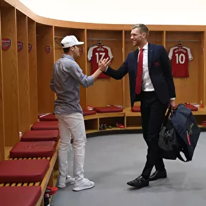 Mesut Ozil and Per Mertesacker in Arsenal Changing Room Before Arsenal v Burnley Match, 2018