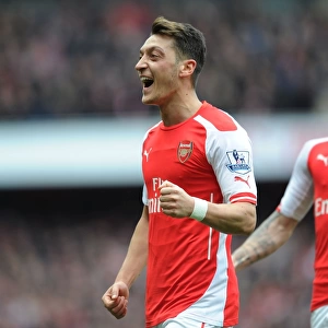 Mesut Ozil Scores the Second Goal: Arsenal's Victory Against Liverpool in the Premier League 2014-15