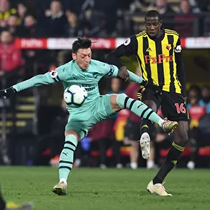 Mesut Ozil vs Abdoulaye Doucoure: A Premier League Battle of Skills and Strength