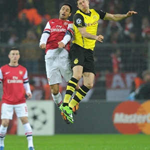 Mikel Arteta vs. Robert Lewandowski: A Battle in the 2013-14 Borussia Dortmund vs. Arsenal UEFA Champions League Match