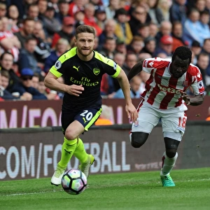 Mustafi vs. Diouf: Intense Clash Between Stoke and Arsenal in Premier League