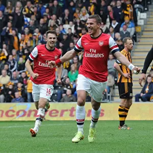 Podolski and Ramsey Celebrate Arsenal's Victory: Hull City vs Arsenal, Premier League 2013/14