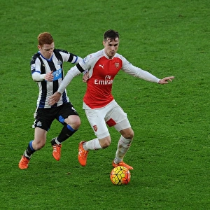Ramsey Stands Firm: Arsenal's Midfielder Fends Off Newcastle's Colback in Intense Premier League Clash