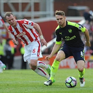 Ramsey vs. Whelan: Intense Battle in Stoke City vs. Arsenal Premier League Clash