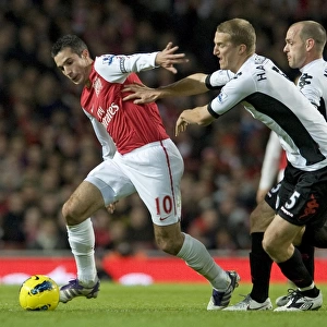 Robin van Persie of Arsenal breaks past Brede Hangeland of Fulham during the Barclays Premier League match between Arsenal and Fulham at Emirates Stadium on November 26, 2011 in London, England. Credit; Arsenal