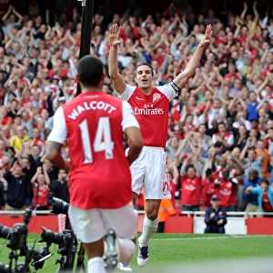 Robin van Persie celebrates scoring his and Arsenals 2nd goal, his 100th goal for Arsenal with Theo Walcott. Arsenal 3: 0 Bolton Wanderers. Barclays Premier League. Emirates Stadium, 24 / 9 / 11. Credit : Arsenal Football Club /