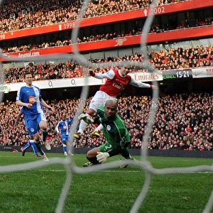 Robin van Persie scores his and Arsenals 1st goal past Ali Al Habsi (Wigan)