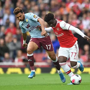 Saka vs Trezeguet: Intense Face-Off in Arsenal's Battle Against Aston Villa