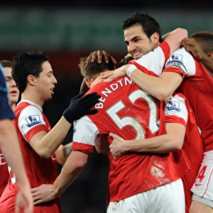 Sebastien Squillaci celebrates scoring for Arsenal with his team mates including Cesc Fabregas