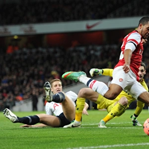 Theo Walcott (Arsenal) Michael Dawson and Hugo Lloris (Tottenham). Arsenal 2: 0 Tottenham Hotspur