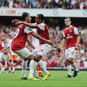 Theo Walcott celebrates scoring the 3rd Arsenal goal with Marouane Chamakh