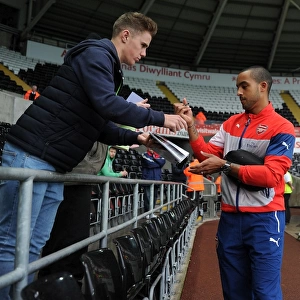 Theo Walcott at Swansea: Arsenal Star Signs Autographs Ahead of Premier League Clash