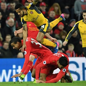 Theo Walcott vs. Liverpool's Defense: Intense Battle at Anfield (Liverpool v Arsenal, Premier League 2016-17)