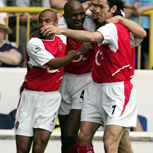 Unforgettable Rivalry: Vieira and Pires Euphoric Goal Celebration at White Hart Lane, 2004