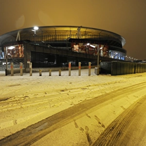 Winter's Embrace at Emirates: Arsenal Football Club under Snow
