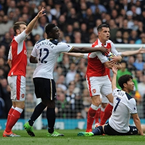 Xhaka Holds Off Son and Wanyama in Intense Tottenham-Arsenal Clash