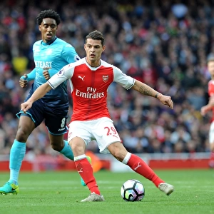 Xhaka Under Pressure: Arsenal's Midfielder Faces Intense Scrutiny from Swansea's Fer in Premier League Showdown