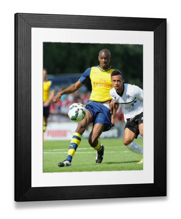 Framed Print : Abou Diaby vs. Sam Cox: A Battle in Arsenal's Pre-Season Clash Against Boreham Wood