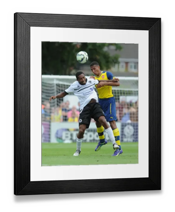 Framed Print : Isaac Hayden (Arsenal) Ricky Shakes (Boreham Wood). Boreham Wood 0: 2 Arsenal. Pre Season Friendly Framed Print : Isaac Hayden (Arsenal) Ricky Shakes (Boreham Wood). Boreham Wood 0: 2 Arsenal. Pre Season Friendly