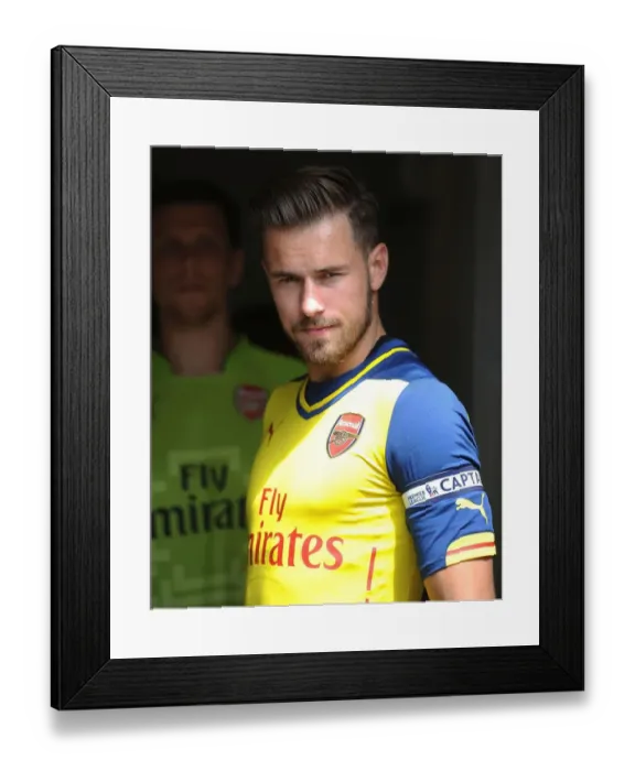 Framed Print : Arsenal's Aaron Ramsey Prepares for Pre-Season Action Against Borehamwood