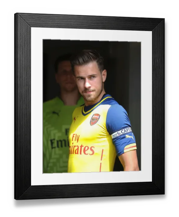 Framed Print : Arsenal's Aaron Ramsey Leads Team in Pre-Season Clash against Boreham Wood Framed Print : Arsenal's Aaron Ramsey Leads Team in Pre-Season Clash against Boreham Wood