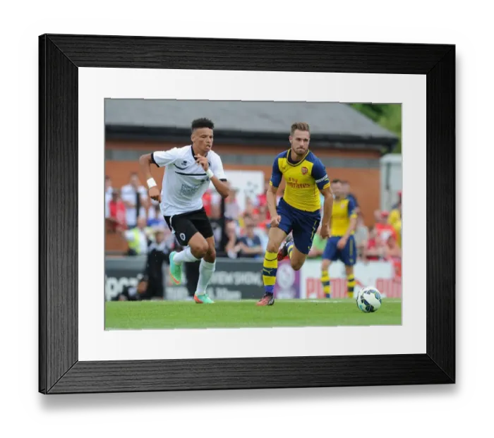Framed Print : Aaron Ramsey Faces Off Against Lee Angol: Borehamwood vs Arsenal Pre-Season Clash Framed Print : Aaron Ramsey Faces Off Against Lee Angol: Borehamwood vs Arsenal Pre-Season Clash