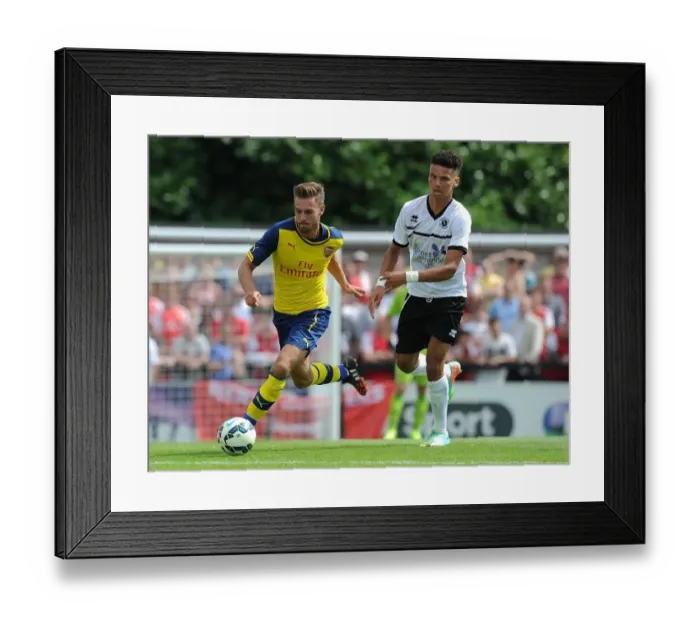 Framed Print : Aaron Ramsey Outmaneuvers Lee Angol in Arsenal's Pre-Season Friendly against Borehamwood Framed Print : Aaron Ramsey Outmaneuvers Lee Angol in Arsenal's Pre-Season Friendly against Borehamwood