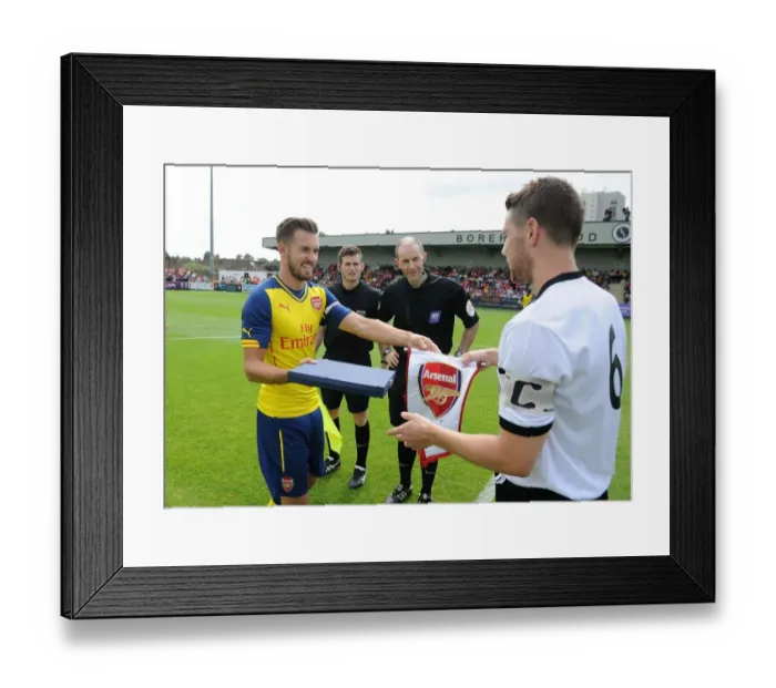 Framed Print : Aaron Ramsey and Callum Reynolds Exchange Gifts: Boreham Wood vs. Arsenal Pre-Season Friendly Framed Print : Aaron Ramsey and Callum Reynolds Exchange Gifts: Boreham Wood vs. Arsenal Pre-Season Friendly