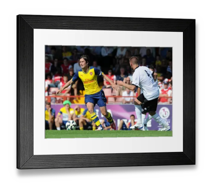 Framed Print : Tomas Rosicky Charges Forward Against Luke Garrard in Borehamwood's Pre-Season Clash with Arsenal