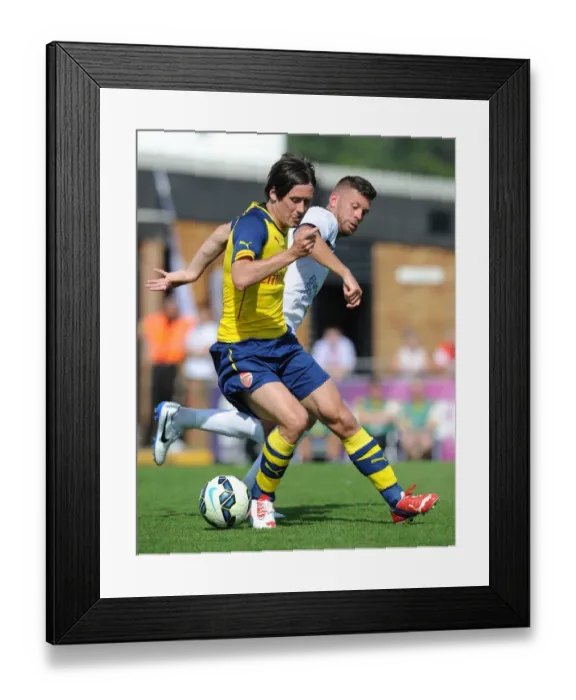 Framed Print : Tomas Rosicky vs. Luke Garrard: A Battle in Arsenal's Pre-Season Friendly Against Boreham Wood