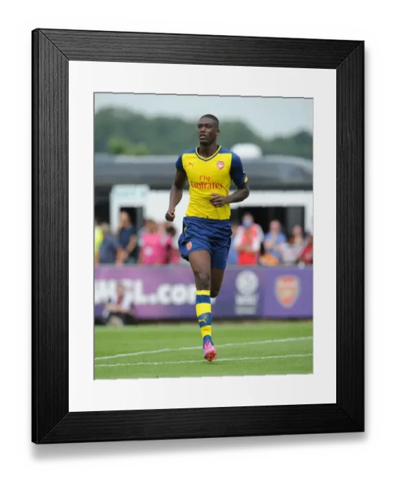 Framed Print : Yaya Sanogo in Action: Arsenal's Pre-Season Triumph over Boreham Wood