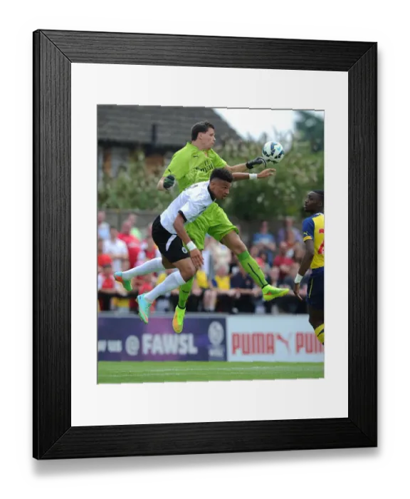 Framed Print : Intense Moment: Szczesny vs. Angol in Arsenal's Pre-Season Clash