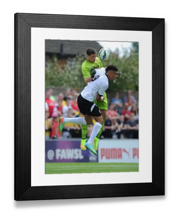 Framed Print : Szczesny vs. Angol: A Fierce Encounter in Arsenal's Pre-Season Clash