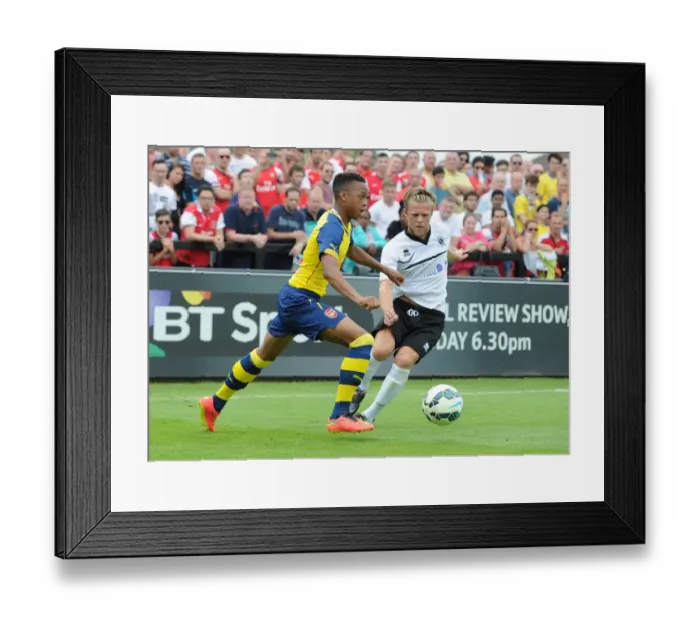 Framed Print : Chris Willock (Arsenal) Ben Nunn (Boreham Wood). Boreham Wood 0: 2 Arsenal. Pre Season Friendly