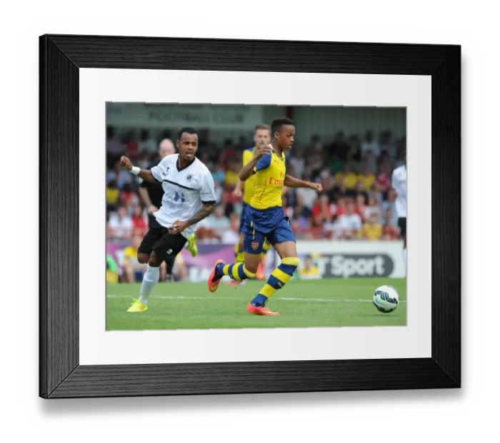 Framed Print : Chris Willock (Arsenal) Matthew Whichelow (Boreham Wood). Boreham Wood 0: 2 Arsenal