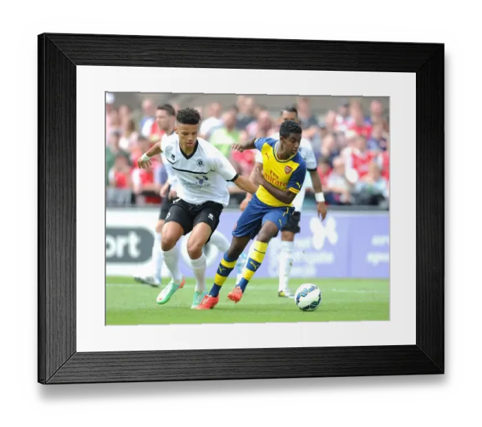 Framed Print : Gedion Zelalem vs. Lee Angol: Battle in the Pre-Season Friendly between Boreham Wood and Arsenal