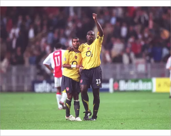 Arsenal captain Sol Campbell and Ashley Cole celebrate after the match