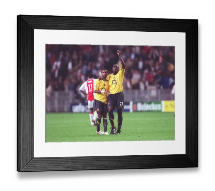 Framed Print : Arsenal captain Sol Campbell and Ashley Cole celebrate after the match Framed Print : Arsenal captain Sol Campbell and Ashley Cole celebrate after the match