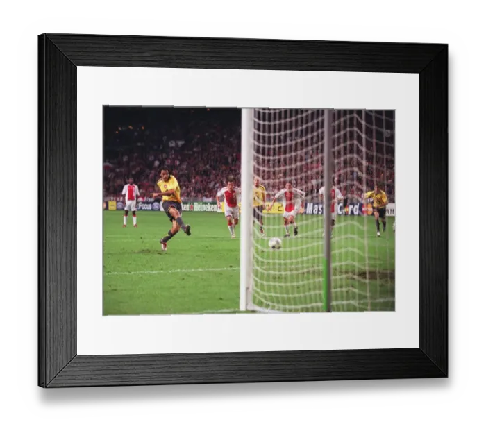 Framed Print : Robert Pires shoots past Ajax goalkeeper Hans Vonk to score the 2nd Arsenal goal from the penalty sp