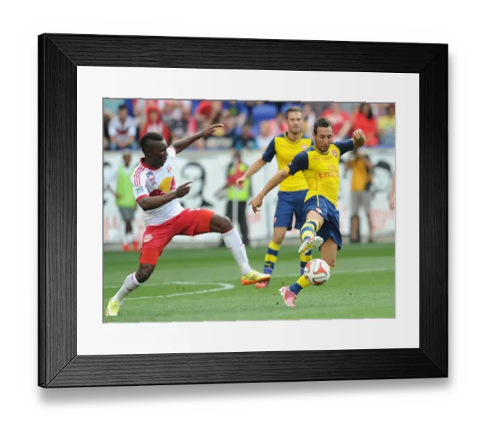 Framed Print : Santi Cazorla vs. Ambroise Oyongo: Arsenal vs. New York Red Bulls Pre-Season Clash