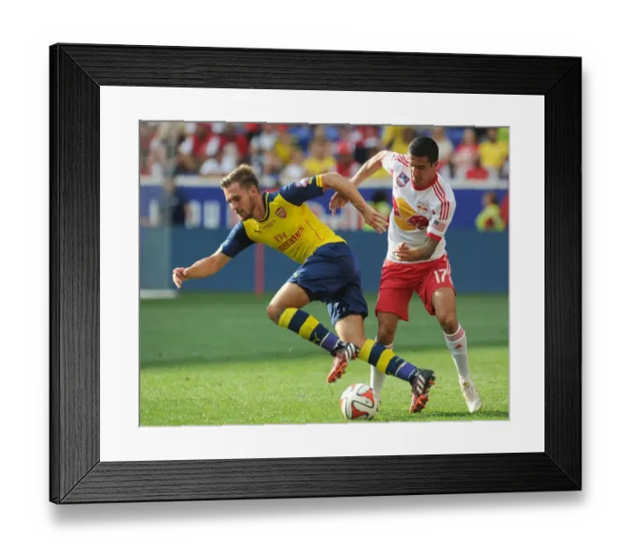 Framed Print : Ramsey vs. Cahill: Clash in Pre-Season Friendly between New York Red Bulls and Arsenal